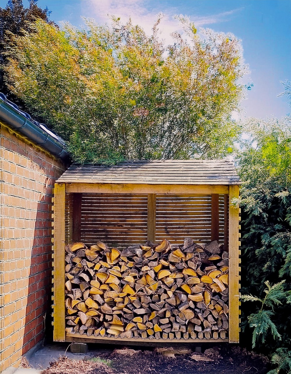 Log Store Holds Enough Wood for Season